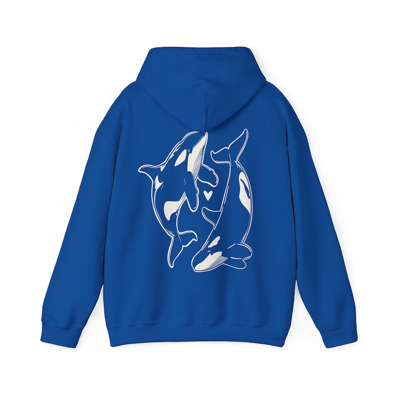 May include: A royal blue hoodie with a white graphic of two orcas intertwined, with a small heart between them.