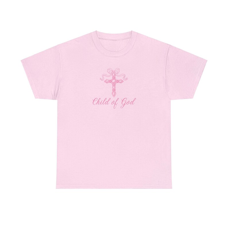 May include: Pink t-shirt with a pink cross and the text "Child of God" printed on the front.