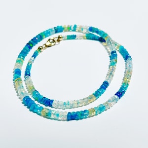 Blue disco opal beaded necklace. multi-color, blue, flashy genuine Ethiopian opal necklace. Beaded candy necklace with 14k gold fill clasp.
