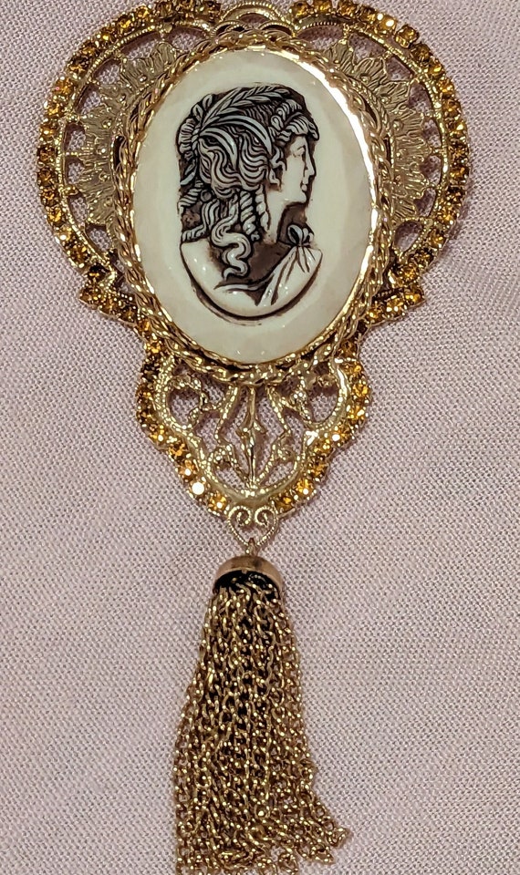 Gold Tone Cameo Brooch with Orange Rhinestones