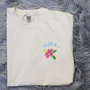 Embroidered Aloha Hawaii Hibiscus flower - Pocket Logo - Hawaii embroidered Unisex T-shirt, Aloha Shirt - Comfort Colors