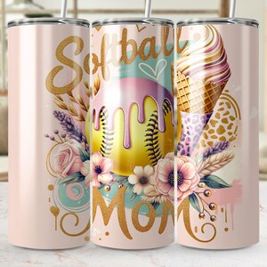 May include: A pink tumbler with a softball design. The tumbler features the words "Softball Mom" in gold script, a yellow softball with pink drips, and floral accents. An ice cream cone graphic is also present.