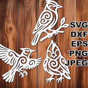 May include: Three white bird cutouts with detailed patterns are shown against a wooden backdrop. One bird is perched on a branch, while the others are in flight. The image includes the text "SVG, DXF, EPS, PNG, JPEG."