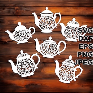 May include: White decorative teapot cutouts with intricate floral designs. The teapots are arranged on a dark brown wooden background. The image also includes text indicating file formats: SVG, DXF, EPS, PNG, and JPEG.