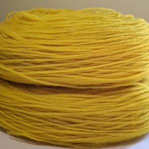 Wool yarn for knitting. High quality yellow unspun wool yarn  . Natural 100% wool yarn.