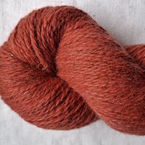 Wool yarn for knitting. High quality  raspberry pink  hand dyed 100 % wool yarn. Natural lanolin yarn.
