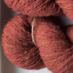 Wool yarn for knitting. High quality red brown with orange wool yarn. Natural lanolin wool yarn.