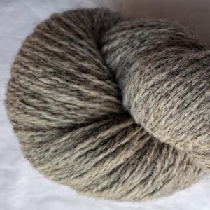 Wool yarn for knitting. High quality grey  hand dyed 100 % wool yarn. Natural lanolin yarn.