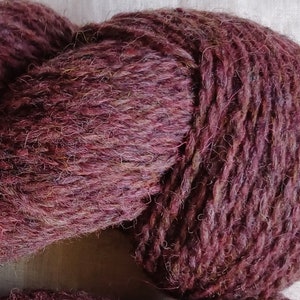 Wool yarn for knitting. High quality multicolor dark pink, purple  hand dyed yarn. Natural lanolin yarn.