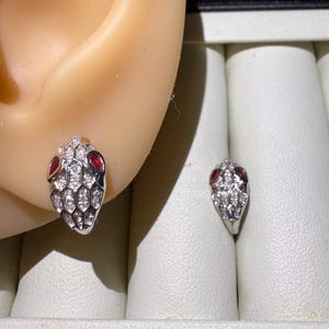 Serpent Ruby Eye 18K gold diamond earrings with certificate