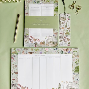 May include: A set of three green and white floral patterned notepad and bookmark. The notepad has a weekly planner and a to-do list. The bookmark has a floral design with a tassel. The text on the notepad reads "Things to do" and "Plan for the week".
