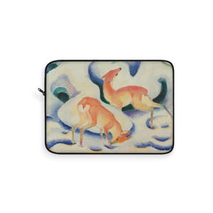 May include: Laptop sleeve featuring a watercolor painting of two deer in a snowy landscape. The deer are shades of orange and brown, set against a backdrop of white, blue, and green. The sleeve has a black border and a zipper.