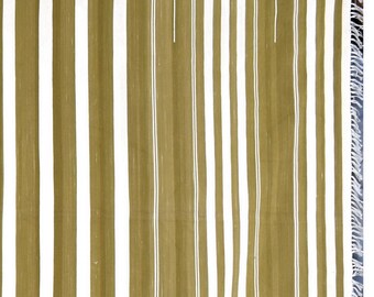 May include: A striped throw blanket with alternating white and olive green stripes. The blanket has a fringe border.
