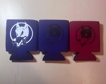 May include: Three beverage insulators in blue and red. Each has a wolf graphic inside a circle. The wolf is white on the blue insulator, and black on the other two. The insulators are made of a foam-like material.