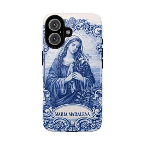 May include: A phone case featuring a blue and white illustration of Maria Madalena, holding flowers. The design is reminiscent of traditional Portuguese tiles, with ornate floral borders and the name "MARIA MADALENA" at the bottom.