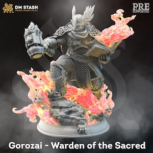 May include: A detailed 3D-printed figurine of Goroza, Warden of the Sacred, a warrior in ornate armor, holding a hammer and a book engulfed in flames. The base features a rocky terrain with fiery accents. The DM STASH logo is visible.