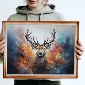 May include: A framed watercolor painting of a deer with large antlers standing in front of a colorful abstract background. The background features shades of blue, orange, yellow, and red.
