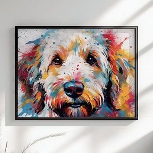 May include: A colorful abstract painting of a dog's face. The dog has white fur with splashes of orange, yellow, blue, and pink paint.
