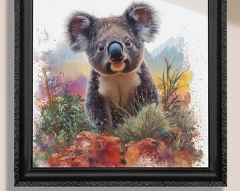 May include: A framed watercolour print of a koala bear. The koala has grey fur, a white chest, and a black nose. The background features colourful brushstrokes of green, yellow, and purple. The frame is black with an ornate design. Text at the bottom reads "Canvas or Paper Print."