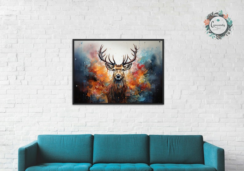May include: A watercolor painting of a deer with large antlers standing in front of a colorful background. The deer is looking directly at the viewer. The background is a mix of blue, orange, and yellow.