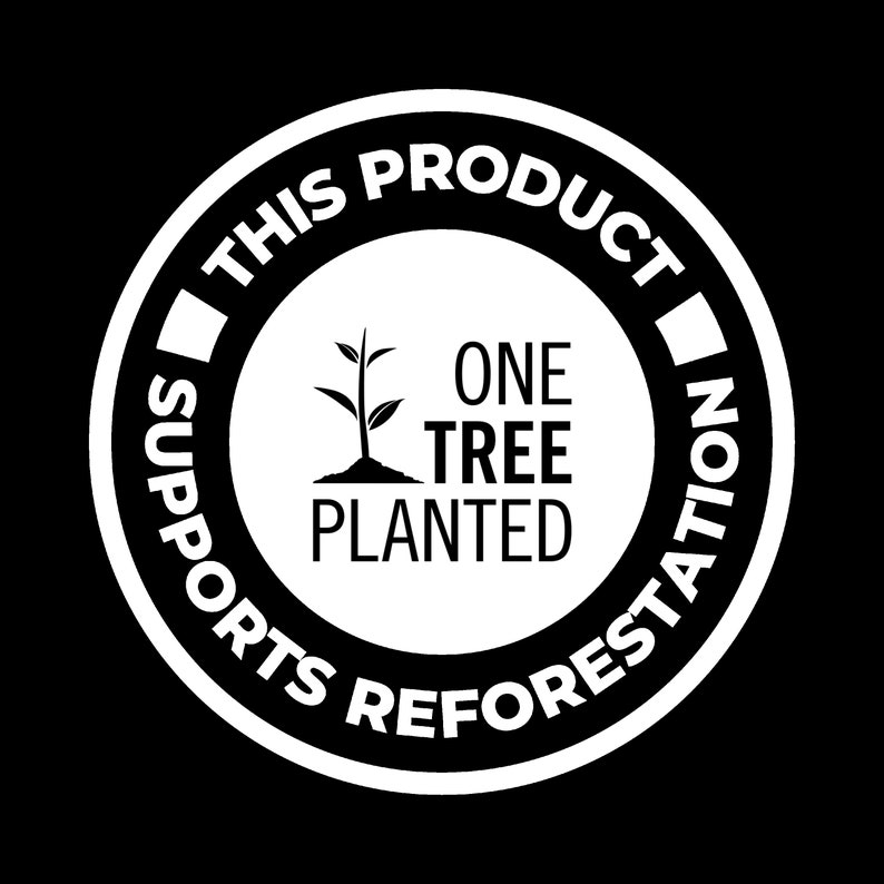 May include: White circle with black text that reads "This product supports reforestation. One tree planted.". Inside the circle is a black silhouette of a tree sapling.