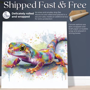 May include: A vibrant watercolor painting of a gecko, showcasing a spectrum of colors including blue, yellow, pink, and green. The artwork features the text "Shipped Fast & Free" and "Delicately rolled and wrapped". The gecko is the focal point, set against a white background.