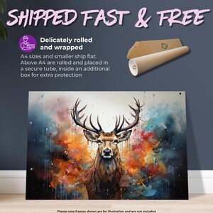 May include: A colorful abstract painting of a deer with large antlers. The deer is in the center of the painting and is surrounded by splashes of color, including blue, green, orange, and red. The background is white.