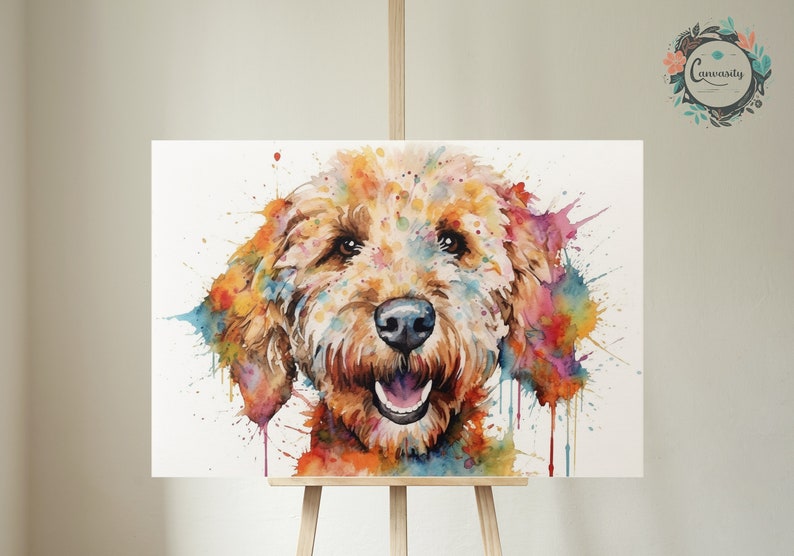 May include: Watercolor painting of a golden doodle dog with colorful splatter paint in the background. The dog is looking directly at the viewer with a happy expression.