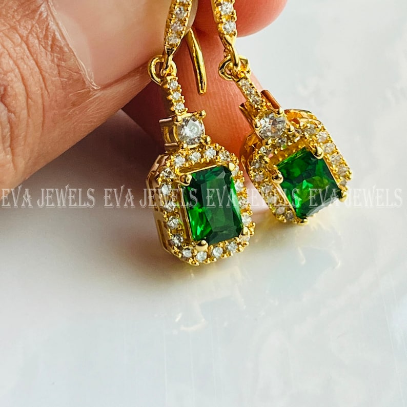 10K Yellow Gold Oval Cut Green Emerald 5x3 mm and 1/7 Cttw Round Diamond Dangle Earrings