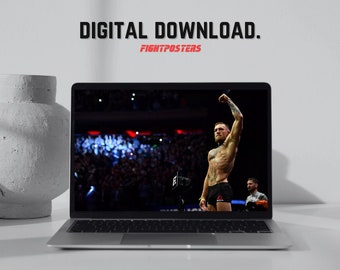 May include: A laptop displays a digital download image of a mixed martial arts fighter raising his arm in victory. The text "DIGITAL DOWNLOAD." and "FIGHTPOSTERS" are visible on the image.