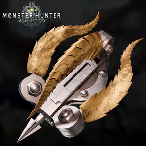 May include: A detailed, close-up image of a Monster Hunter World weapon. The weapon features a silver and gold color scheme, with a central metallic body and ornate, textured gold accents. A sharp, silver point extends from the weapon's base.