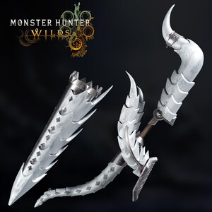 May include: A white and silver weapon set featuring a curved blade, a long blade, and a sheath. The weapons have a textured, scale-like design against a dark backdrop. The text "MONSTER HUNTER WILDS" is displayed.