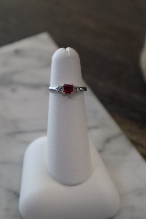 10kt White Gold Princess Cut Ruby with two .08ct s