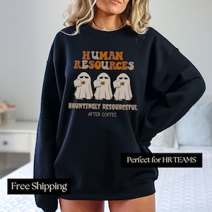 May include: Black sweatshirt with a graphic of three ghosts holding coffee cups and the text "Human Resources Hauntingly Resourceful After Coffee". The text "Perfect for HR Teams" is at the bottom of the sweatshirt.