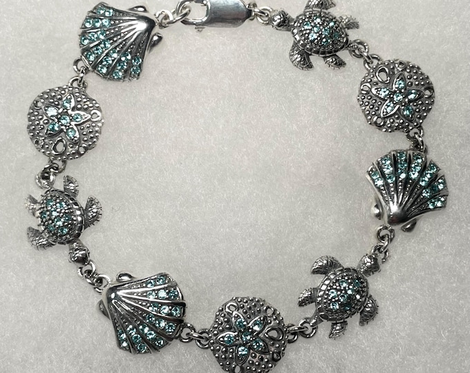 Sterling Silver 8" Scallop, Turtle, and Sand Dollar Bracelet with Faceted Aqua Crystal Stones
