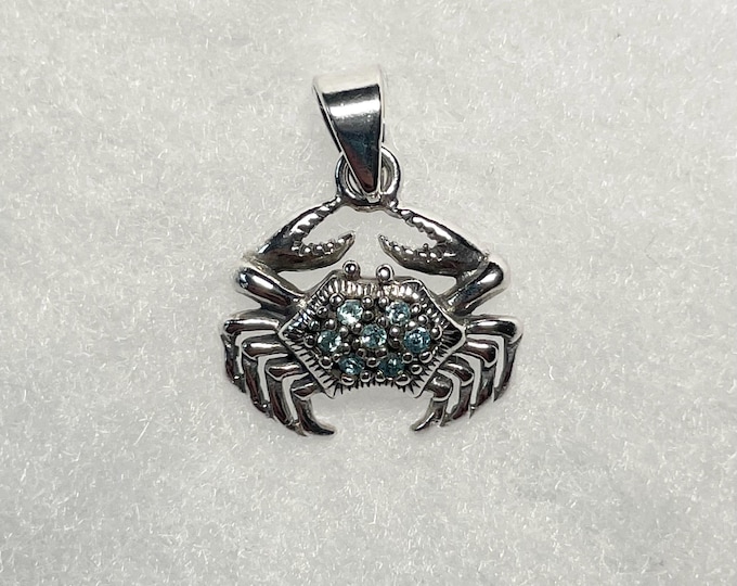 Sterling Silver Crab Pendant with aqua crystal stones.
