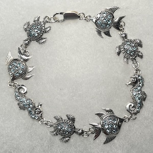 Sterling Silver 8&quot; Angelfish, Turtle, and Seahorse Bracelet with Faceted Aqua Crystal Stones
