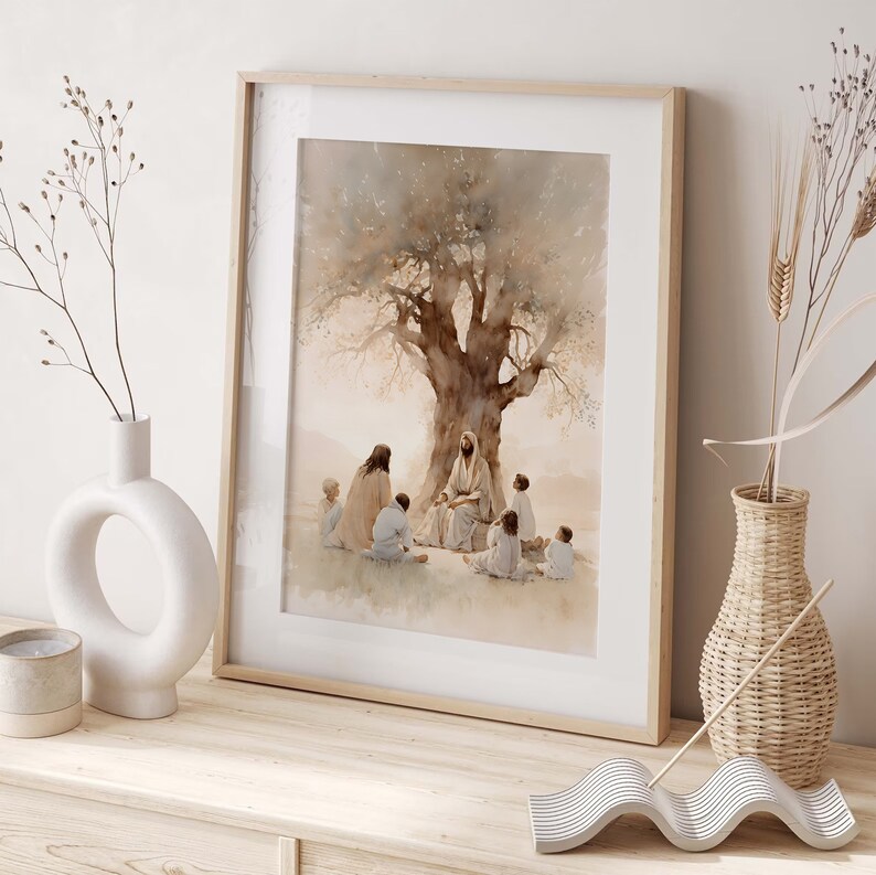 May include: A framed watercolor painting depicting Jesus teaching a group of children under a large tree. The painting is in shades of brown and beige, with a soft, ethereal quality. The children are sitting around Jesus, listening intently.