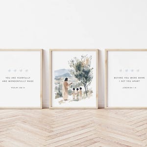 May include: Three framed prints with watercolor illustrations and inspirational quotes. The center print features a painting of Jesus with two children. The left print says "You are fearfully and wonderfully made, Psalm 139:14". The right print says "Before you were born I set you apart, Jeremiah 1:5".