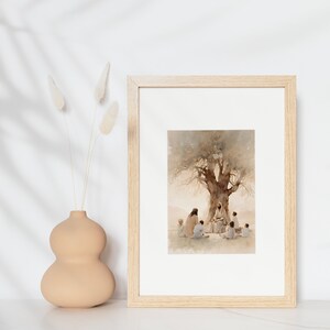 May include: A framed watercolor painting depicting a group of people sitting under a tree. The central figure is seated and surrounded by others, suggesting a scene of teaching or storytelling. The painting is set against a soft, light background.