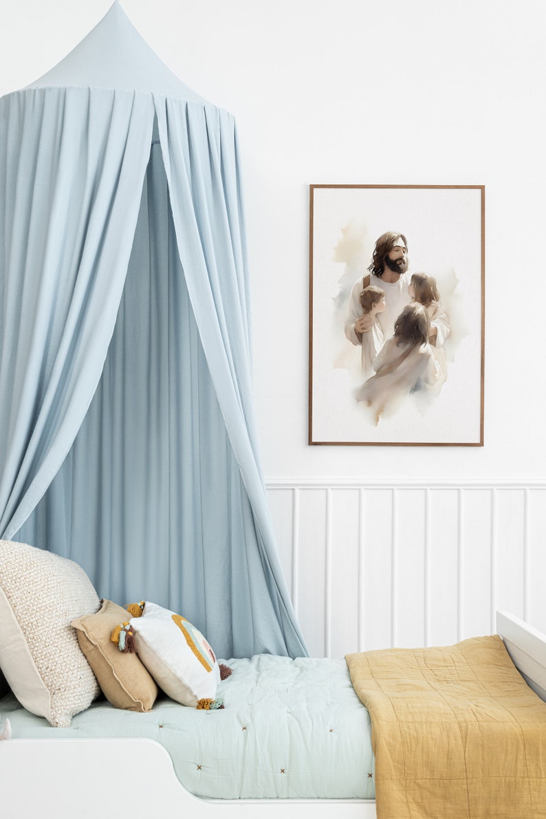 May include: A light blue canopy bed with a white and brown patterned quilt and pillows. A framed watercolor painting of Jesus holding children is on the wall behind the bed.