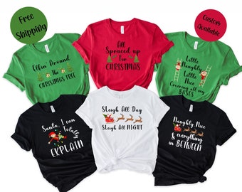 May include: Six different Christmas themed t-shirts with various designs and text. The shirts are in red, green, white, and black.