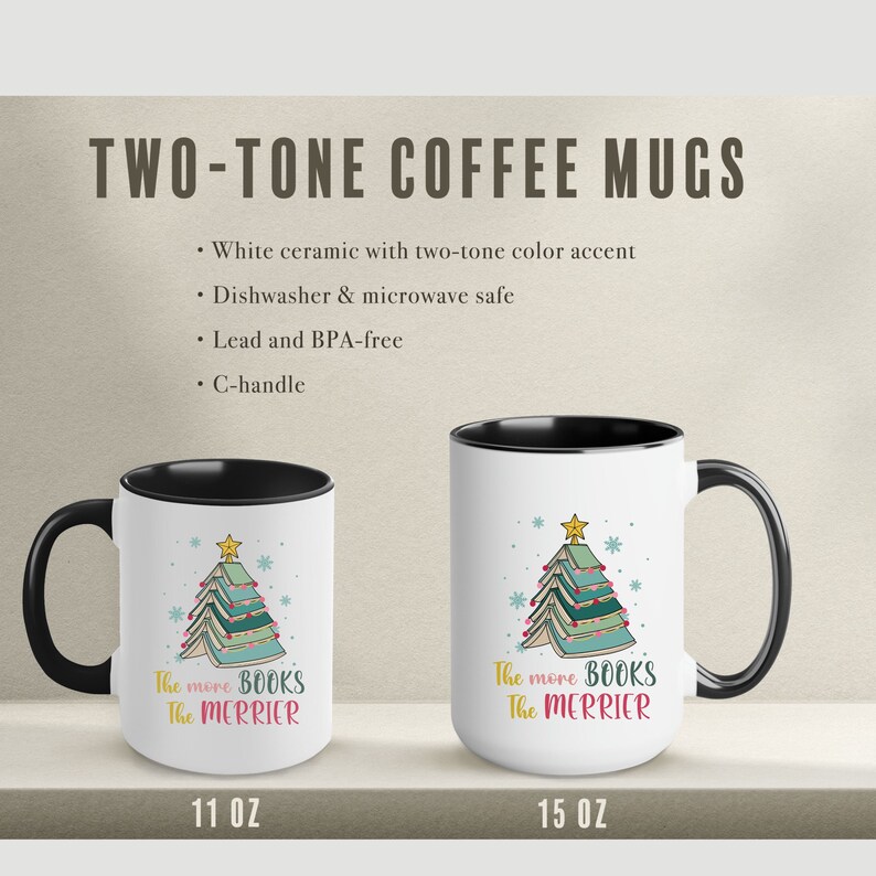 May include: Two white ceramic coffee mugs with black handles. Both mugs feature a Christmas tree design made of stacked books with the text "The more BOOKS The MERRIER". The mug on the left is 11 oz and the mug on the right is 15 oz.