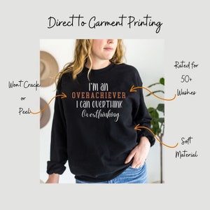 May include: Black sweatshirt with the text "I'm an OVERACHIEVER I can overTHINK Overthinking" printed on the front. The sweatshirt is made of soft material and is rated for 50+ washes.