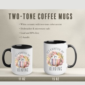 May include: Two-tone coffee mugs with a white ceramic exterior and black interior. The mugs feature the text "It's a beautiful day for reading" with a floral wreath design. Available in 11 oz and 15 oz sizes.