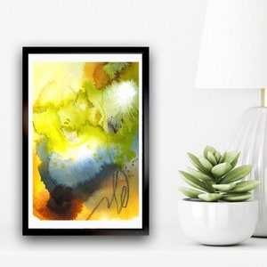 May include: Abstract watercolor painting in shades of yellow, green, blue, and brown. The painting has a loose, flowing style and features a large, central blob of yellow.