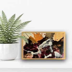 May include: Abstract painting in a gold frame with splashes of orange, white, black, and purple paint.