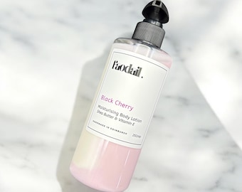 May include: A pink bottle of Faodail. Black Cherry Moisturizing Body Lotion with Shea Butter & Vitamin E. The bottle is 250ml and is handmade in Edinburgh.