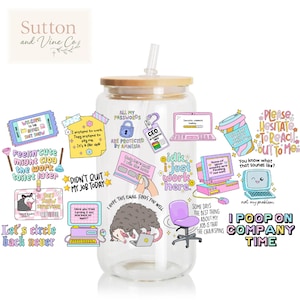 May include: A clear glass tumbler with a wooden lid and straw, decorated with colorful work-related stickers and a cartoon opossum. The tumbler has the text "I POOP ON COMPANY TIME".