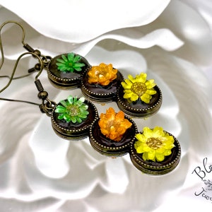 Real Green, Orange & Yellow Star Flowers on Black Triple Stack Round Cabochon Earrings